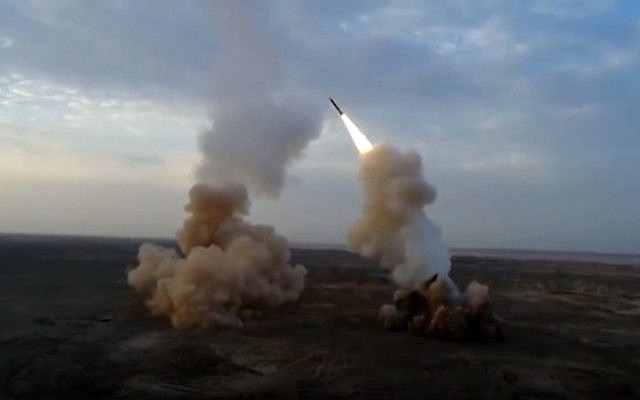 The Iranian Revolutionary Guard launch underground ballistic missiles during a military exercise, July 29, 2020. (IRGC via AP)