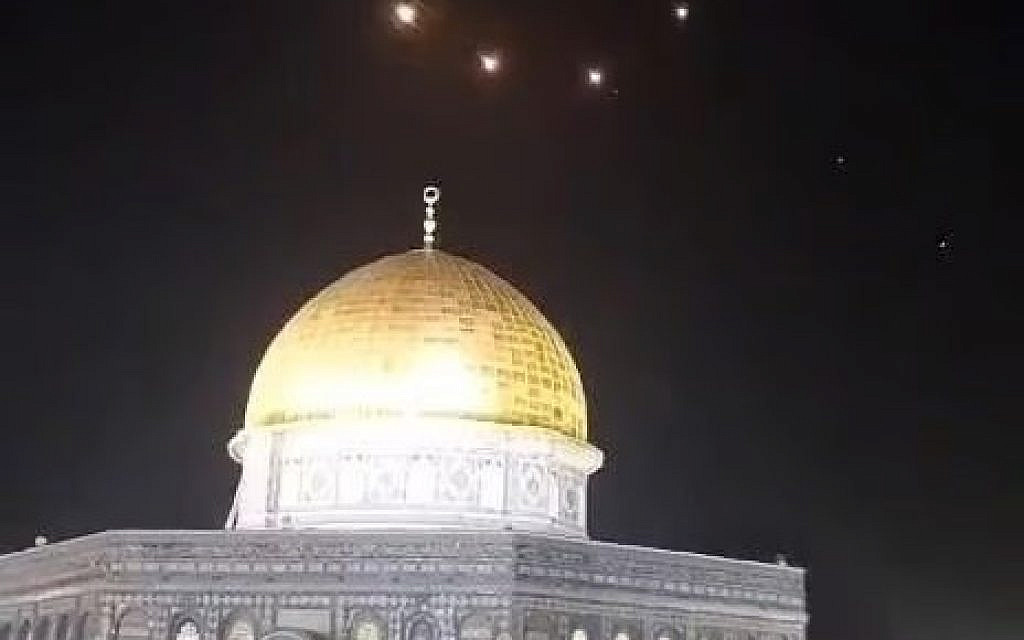 The Dome of the Rock atop the Temple Mount in Jerusalem's Old City, with the lights of missile interceptions visible in the night sky, early on April 14, 2024, after Iran fired ballistic missiles at Israel. (via Facebook)