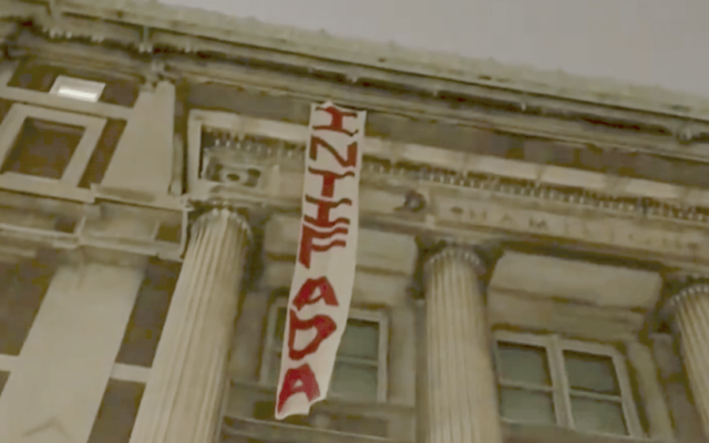 An 'Intifada' banner hung over Columbia University's Hamilton Hall after anti-Israel students took over the building on April 30, 2024. (Jessica Schwalb)