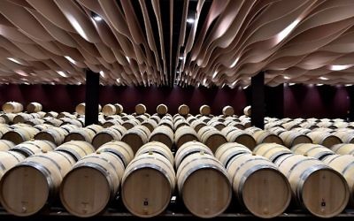 This file photo taken on March 30, 2017, shows wine barrels in the wine cellar of the Chateau de Beychevelle in Saint Julien de Beychevelle. (AFP Photo/Georges Gobet)