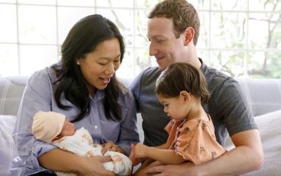 Mark Zuckerberg (R) and his wife Priscilla Chan(L) with their two children Maxima and newborn August (Courtesy/Facebook)