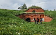 A film crew preparing to record at the former concentration camp known as the Seventh Fort in Kaunas, Lithuania, on July 12, 2016. (JTA/Cnaan Liphshiz)