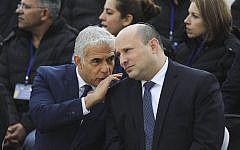 Prime Minister Naftali Bennett and Minister of Foreign Affairs Yair Lapid attend  the departure ceremony of the Israeli aid delegation for the establishment of a field hospital in Ukraine on March 21, 2022 at Ben Gurion airport near Tel Aviv. Photo by Marc Israel Sellem/POOL ***POOL PICTURE, EDITORIAL USE ONLY/NO SALES, PLEASE CREDIT THE PHOTOGRAPHER AS WRITTEN - MARC ISRAEL SELLEM/POOL*** *** Local Caption *** ראש הממשלה, נפתלי בנט, השתתף בטקס יציאת משלחת הסיוע הישראלית להקמת בית חולים שדה באוקראינה