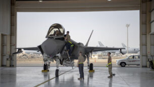 In this Aug. 5, 2019, photo released by the U.S. Air Force, an F-35 fighter jet pilot and crew prepare for a mission at Al-Dhafra Air Base in the United Arab Emirates. A U.S.-brokered deal that saw Israel and the United Arab Emirates begin to open diplomatic ties may end up with Abu Dhabi purchasing advanced American weaponry like the F-35, potentially upending both a longstanding Israeli military edge regionally and the balance of power with Iran. (Staff Sgt. Chris Thornbury/U.S. Air Force via AP)