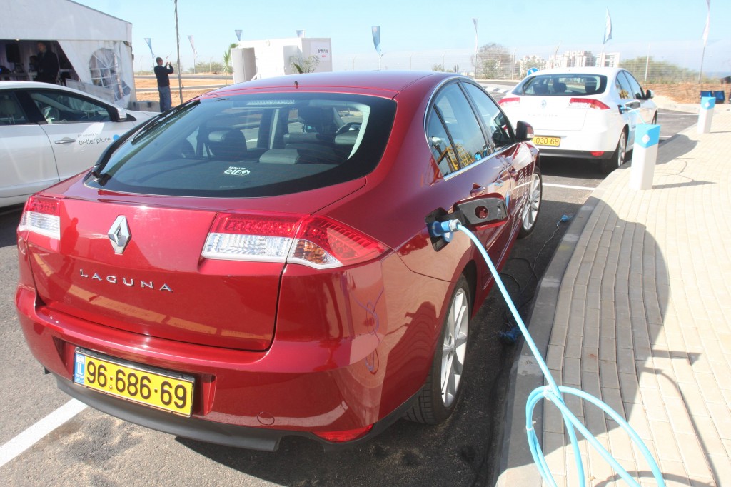 A Renault electric car recharges at a charging station in Ramat Hasharon (Photo credit: Roni Schutzer/Flash90)