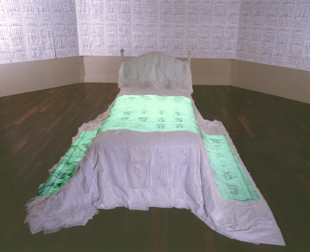 Helène Aylon, My Bridal Chamber, 2001, installation: My Marriage Bed, bed and video projection, 6 min. loop; My Clean Days, installation: bed, black marker on photocopies, paper and gauze,collection of the artist (Courtesy)