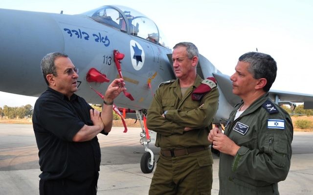 Defense Minister Ehud Barak, left, speaking to IDF head Benny Gantz, center and IAF chief Amir Eshel. (photo credit: Ariel Hermoni/DefenseMinistry/Flash90)