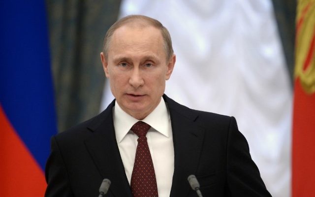 Le président russe Vladimir Poutine prononce un discours lors d'une cérémonie au Kremlin, le 25 mars 2014 (Crédit : Alexei Nikolsky/AFP Photo/Ria Novosti/POOL)