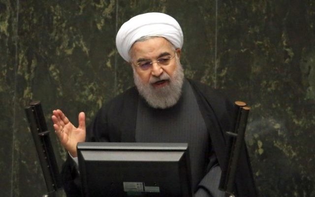 Le président iranien Hassan Rouhani s'exprime devant le parlement après la levée des sanctions par l'accord nucléaire, à Téhéran, le 17 janvier 2016. (Crédit : Atta Kenare/AFP)