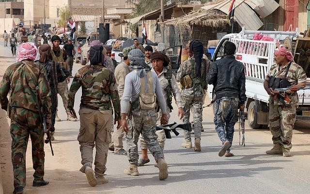 Des forces irakiennes pro-gouvernementales à Rawa, le 18 novembre 2018, après que les troupes ont repris la vallée de l'Euphrate du groupe Etat islamique. 'Crédit : AFP/Suleiman al-ANBARI)