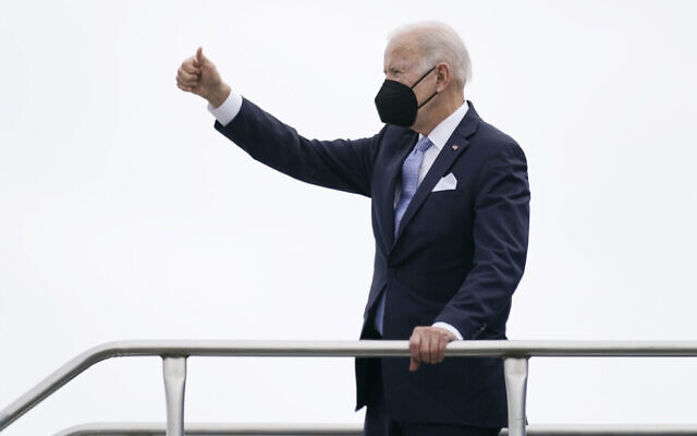 President Joe Biden gives a thumbs up as he boards Air Force One at Columbia Metropolitan Airport in West Columbia, S.C., en route to Philadelphia after speaking at the South Carolina State University's 2021 Fall Commencement Ceremony in Orangeburg, S.C., Friday, Dec. 17, 2021. (AP Photo/Carolyn Kaster)