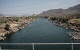 Le Nil coule depuis le Grand Ethiopian Renaissance Dam (GERD) à Guba, en Éthiopie, le 19 février 2022. (Crédit : Amanuel SILESHI / AFP)