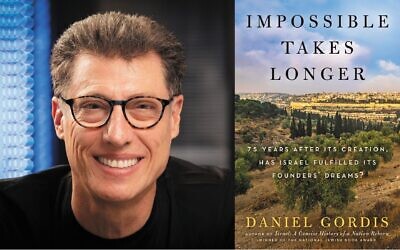 L'auteur Daniel Gordis et son dernier livre, "Impossible Takes Longer". (Crédit : Yoram Reshef Studios)