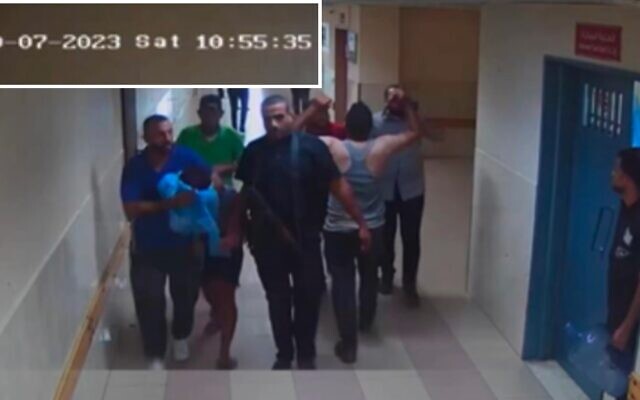 Des terroristes du Hamas amènent un otage à l’hôpital al-Shifa, comme le montrent des images de vidéo-surveillance du 7 octobre 2023. (Crédit : Armée israélienne)