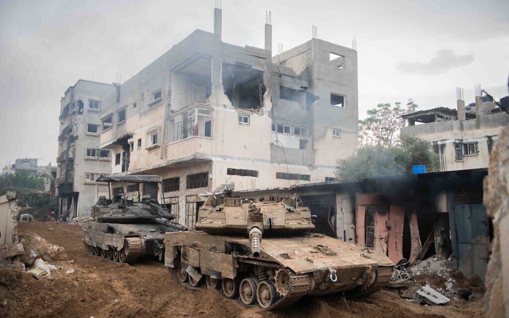 Des véhicules blindés de l’armée israélienne positionnés à l'intérieur de la bande de Gaza, sur une photo non datée publiée le 28 décembre 2023. (Crédit : Armée israélienne)