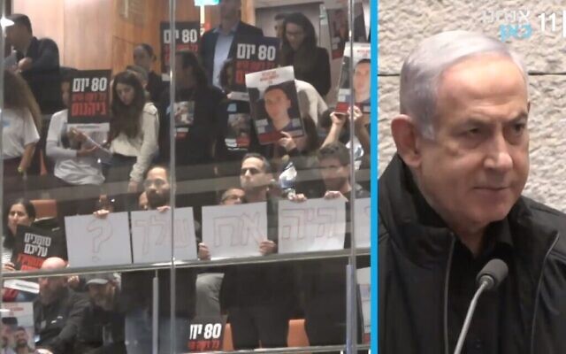 Une capture d'écran de la chaîne de télévision publique Kan montre le Premier ministre Benjamin Netanyahu parlant à la Knesset alors que les familles des personnes retenues en otage par le Hamas à Gaza tiennent des pancartes et crient "maintenant, maintenant, maintenant", demandant leur libération. (Capture d'écran, utilisée conformément à l'article 27a de la loi sur le droit d'auteur)