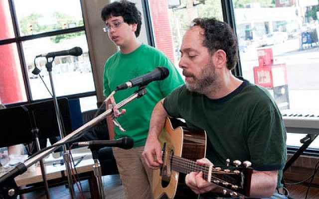 Mark Perlin and his son Eitan sing a song Perlin wrote, titled “Lavender,” at Shul of Rock. (Chronicle photos by Ohad Cadji)