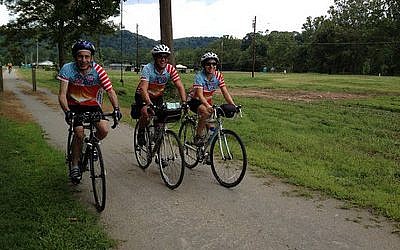 Adi Segal, center, completed the entire Hazon Cross-USA Ride, which started in Seattle and ends in Washington, D.C. Danielle Schindler, who rode from Chicago to Washington, D.C., joins him and his father, who joined the group in Pittsburgh. (Photo courtesy of Adi Segal)