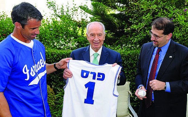 Israeli President Shimon Peres displays a Team Israel baseball jersey with his name on the back, which he received during a recent visit with Brad Ausmus (left) manager of Team Israel, and U.S. Ambassador to Israel Dan Shapiro. Team Israel will play in a qualifying round for the World Baseball Classic in September. (Photo by U.S. Embassy, Tel Aviv)