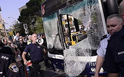 Prior to the cease-fire, Israeli police and rescue personnel at the scene of a bombing on a Tel Aviv passenger bus Wednesday, Nov. 21, that left 20 people wounded. (Credit: Tomer Neuberg/Flash90)