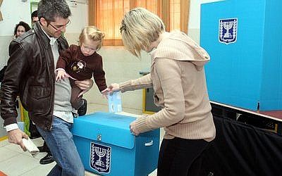 An Israeli family casts a ballot at a polling station in Tel Aviv on Feb. 10, 2009. (Flash90)