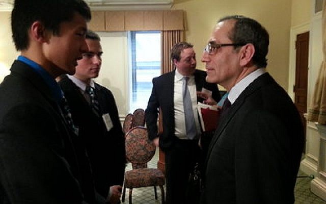 Shady Side Academy seniors Perry Cao and Tony Satryan speak with Egyptian Ambassador to the United States Mohamed M. Tawfik Friday during a luncheon at the Duquesne Club, Downtown. (Chronicle photo by Matt Wein)