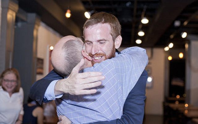 Dan Gilman embraces his friend Malika Sinha during his election party at Up Modern Kitchen in Shadyside, Tuesday, May 21. Gilman won the Democratic primary for City Council in Pittsburgh’s 8th District that day. If he wins in November, he will be the first Jewish Pittsburgh councilman since Dan Cohen. (Chronicle photo by Ohad Cadji)