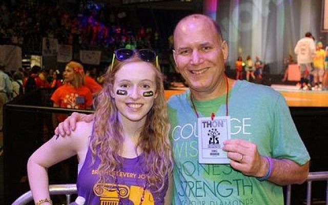 Once the reason for a fundraising effort across Pittsburgh, Amy Katz, now a senior at Penn State, today raises money for worthy causes. Katz is pictured at the Penn States fundraiser, THON, with her father, Mike Katz, who was at the event. (Katz family photo)