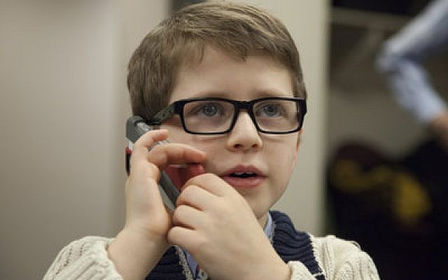 Noah Indianer, 8, talks to a donor on the phone. (Chronicle photos by Sam Oshlag)