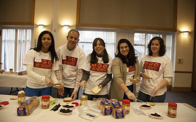 Delilah Picart (left), Todd Rosenfeld (another Mitzvah Day chair), Jewish Federation Volunteer Center Chair Judi Kanal, Mia Rosenfeld and Jordana Rosenfeld, volunteered to make sandwiches for the Squirrel Hill Community Food Pantry. (Chronicle photo by Sam Oshlag)