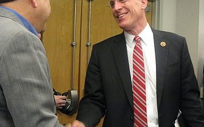 U.S. Rep. Tim Murphy (R-Upper St. Clair) shakes hands with Eric Perelman, a member of the Jewish Family & Children’s Service board of directors, during his visit to JF&CS last week. Murphy stopped by to discuss the Helping Families in Mental Health Crisis Act, which he is sponsoring. (Elizabeth Waickman photo, JF&CS)