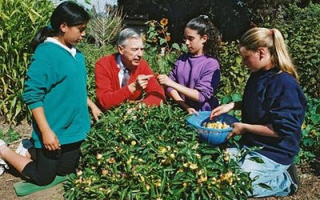 The late Fred Rogers, seen here discussing gardening with children, is this year’s recipient of the Pursuer of Peace Award presented by Rodef Shalom Congregation. (Photo courtesy of Rodef Shalom)