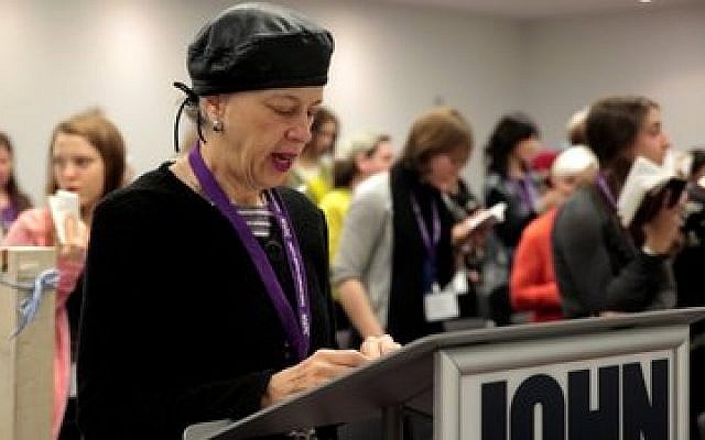 Ruth Lockshin of Toronto leads a partnership minyan at a conference in New York of the Jewish Orthodox Feminist Alliance, December 2013. (JTA photo, Mike Kelly)