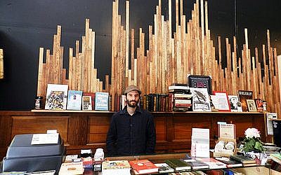 Amazing Books owner Eric Ackland, pictured above in his store’s flagship Downtown space, has high hopes for the bookstore’s new Squirrel Hill location.