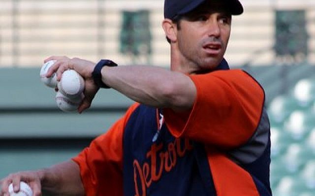 Tigers first-year manager Brad Ausmus, a player for 18 seasons, throws batting practice prior to a recent game against the Orioles.