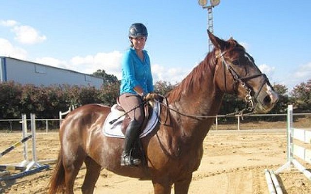 Equestrian show jumper and Olympic hopeful Danielle Goldstein practices her routine in central Israel.