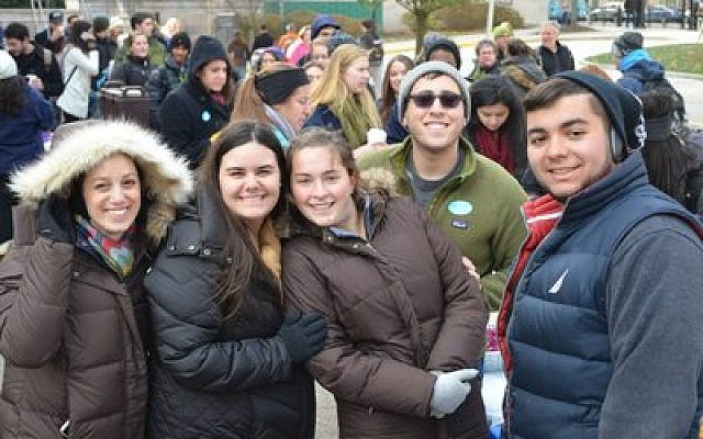 A large gathering of Pitt students was among the nearly 200 people who braved cold temperatures to enjoy free kosher and halal Middle Eastern fare. (Photo provided by Panthers for Israel)