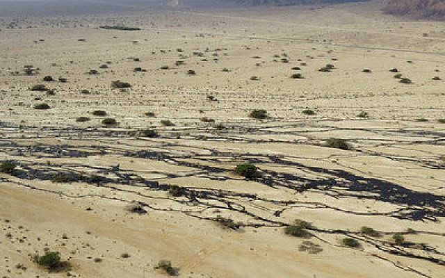 This aerial view shows the damage of a December 2014 oil leak in the Arava area of southern Israel, near where the Eilat-Eilot Renewable Energy Initiative is under way to reduce the world’s reliance on petroleum. (Photo provided by Israeli Environmental Protection Ministry)