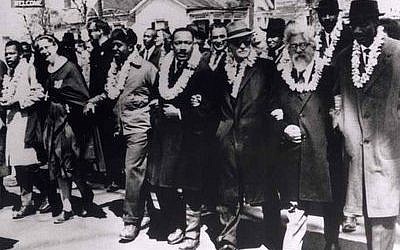 Rabbi Abraham Joshua Heschel, second from right, participates in the civil rights march from Selma to Montgomery, Ala., on March 21, 1965. (Photos provided by Susannah Heschel)