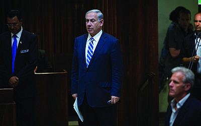 Israeli Prime Minister Benjamin Netanyahu, shown in the Knesset last week, pulled together a government coalition just 90 minutes before the deadline. (Photo by Miriam Alster/Flash90)
