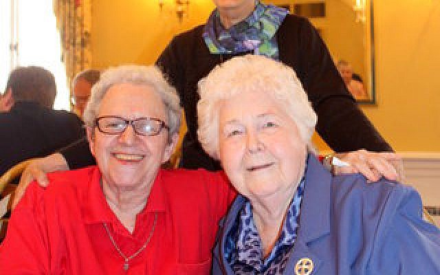 Holocaust survivor Shulamit Bastacky (left) shares a smile with Sister Mary Noel Kernan and Sister Gemma Del Duca (standing). (Photo by Simone Shapiro)