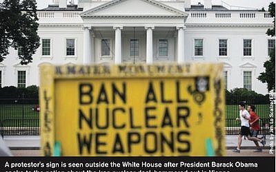 A protestor's sign is seen outside the White House after President Barack Obama spoke to the nation about the Iran nuclear deal, hammered out in Vienna. (Photo by Jim Lo Scalzo/EPA)