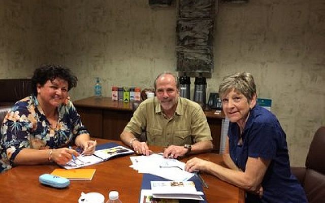 From left: Sabaa Hassan Sayed, Mark Frank and Jane Cynkus study best practices at Pittsburgh's Manchester Bidwell Corporation. (Photo by Toby Tabachnick)