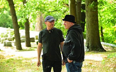 David Simon (right) talks with director Paul Haggis on the set of Simon’s new HBO series “Show Me a Hero.” (Photo courtesy of HBO)