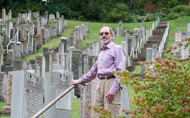 President of the JCBA Jonathan Schachter looks over the Machsikei Hadas Cemetery. Schachter ensures the maintenance of many of the Pittsburgh-area Jewish Cemeteries. (Photo by Lindsay Dill)