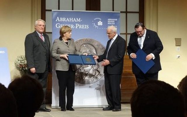 German Chancellor Dr. Angela Merkel receives the Abraham Geiger Prize. She is surrounded by (from left) Dr. Josef Joffe of the Abraham Geiger College, college president Rabbi Dr. Walter Jacob and rector Rabbi Dr. Walter Homolka. (Photo by Henry Posner III)