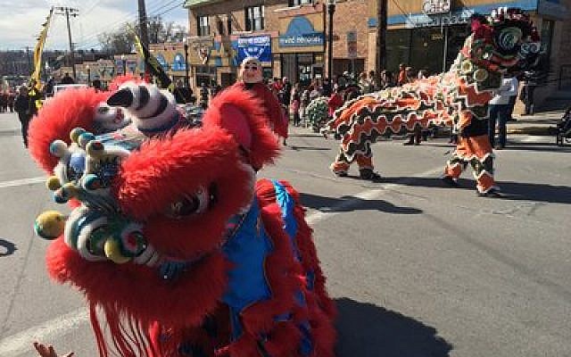 Colorful lions make their way through Squirrel Hill as part of the Lunar New Year Parade.

Photo by Jim Busis