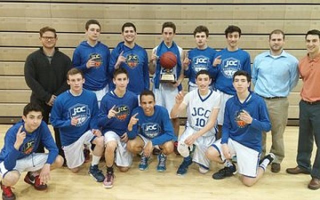 The victorious JCC boys basketball team poses with the league’s championship trophy.

Photo by Jeremy Kelley