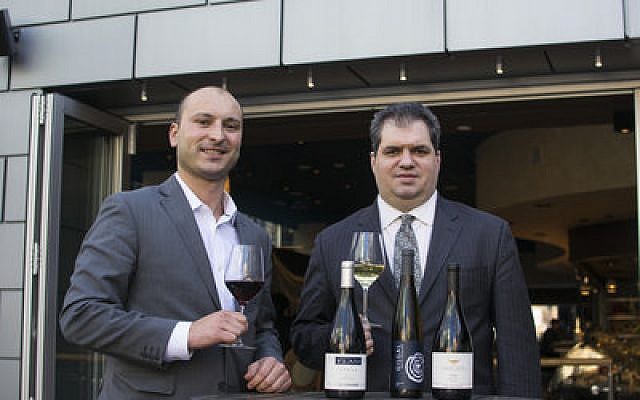 Nicholas Rizzo (left), general manager of Poros, and Alan Uchrinscko, assistant general manager and sommelier, say the Israeli wines featured at Poros are “selling well.”

Photo provided by Poros