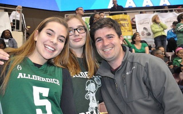 Councilman Corey O’Connor joins a couple of happy Allderdice students at Saturday night’s state championship. 

Photo by Adam Reinherz